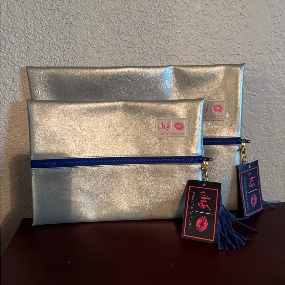 NWT Silver Makeup Junkie Bags with Blue Zipper
Large and medium set
